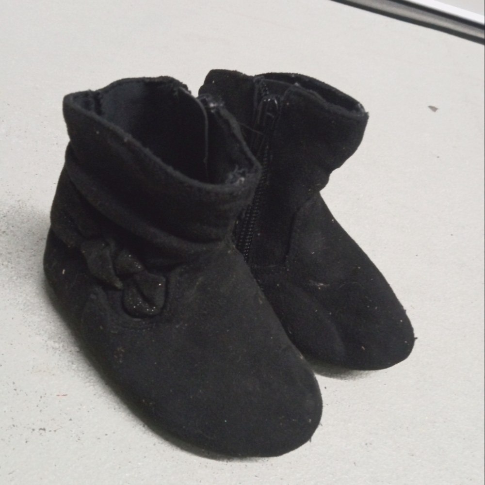 Soft black boots with a bow